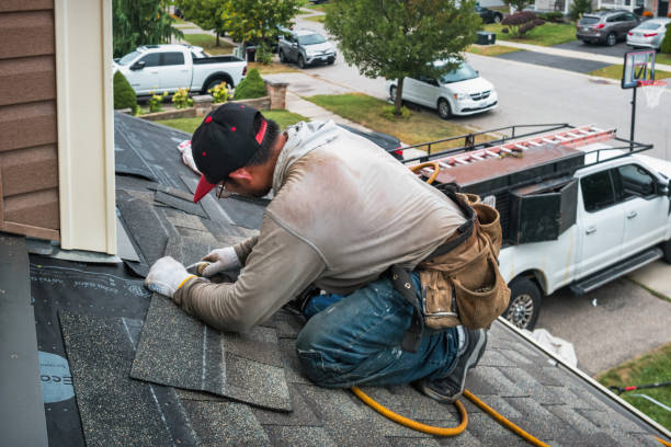 Professional Roofing technician working in North Hills, NY